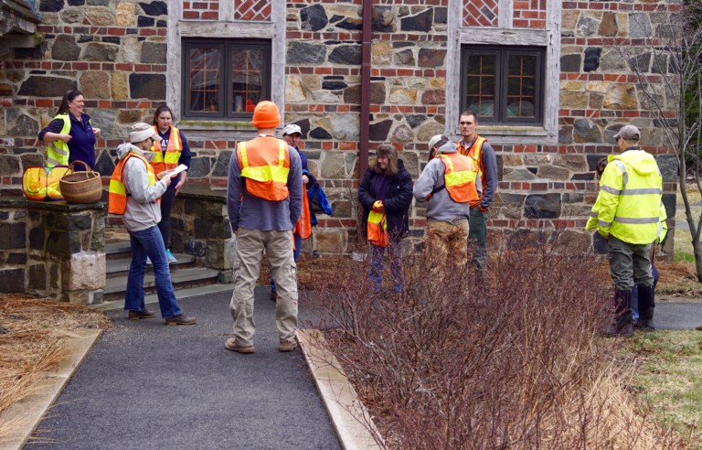 photo of schoodic institute staff cleaning up trash from the roadside