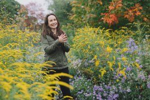 Deb Perkins in flowering garden