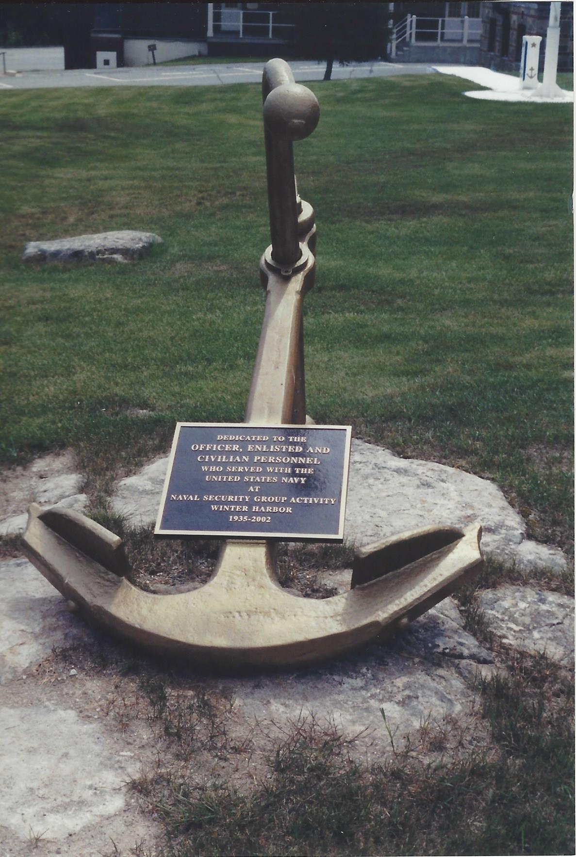 Anchor to commemorate Navy in foreground, grass in background