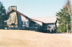 Schooner Club, now Schooner Commons, with grass in foreground, blue sky in background