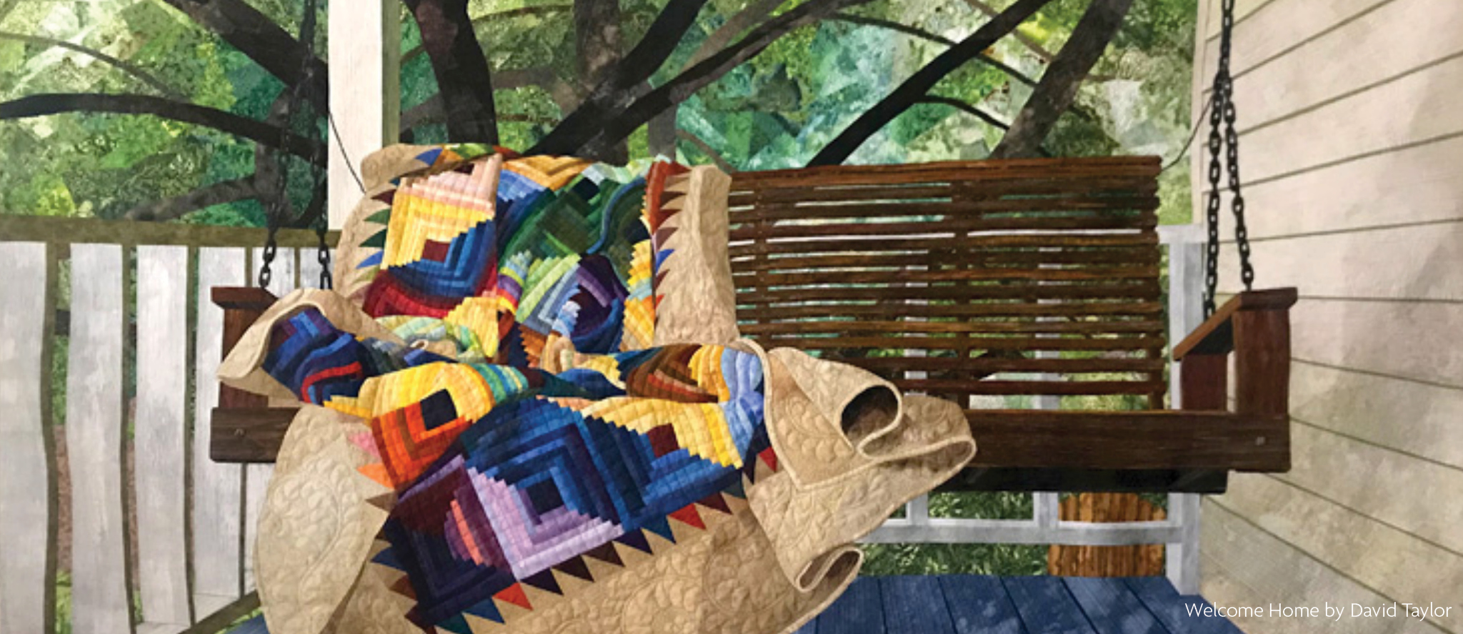 A quilt laid over a wooden porch swing with trees in the background. The piece is called "Welcome Home", by David Taylor.