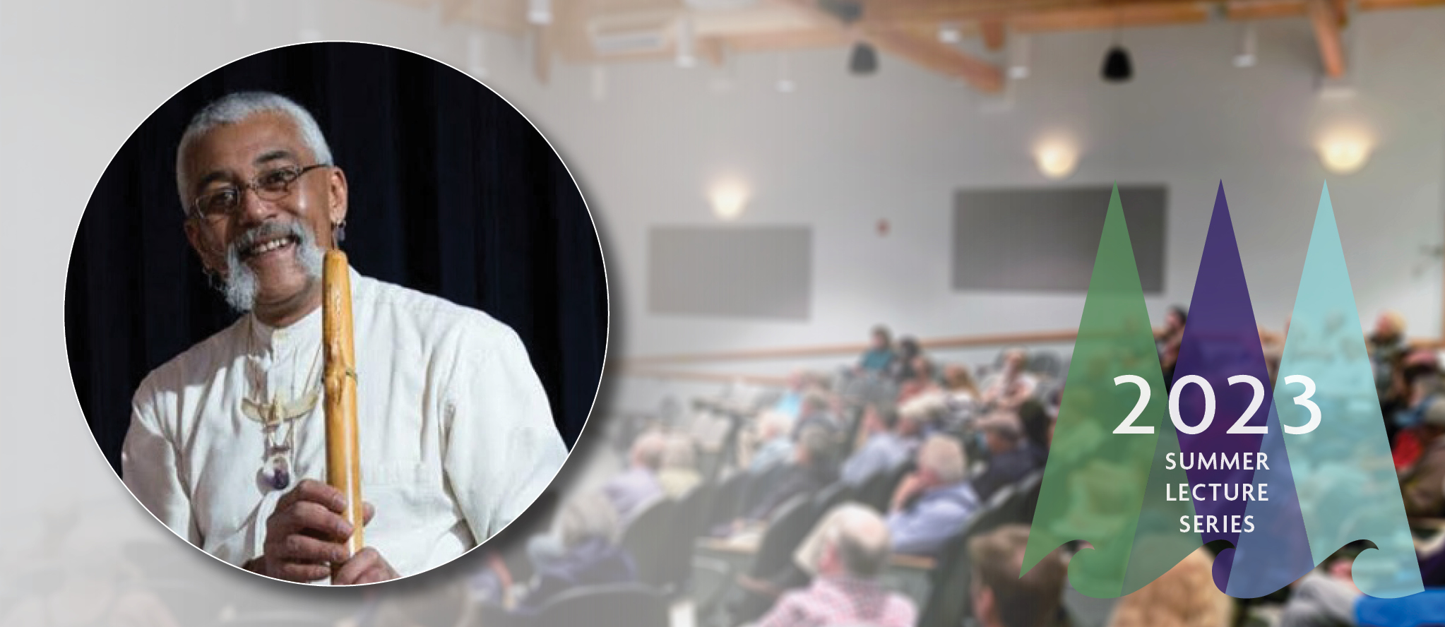 Headshot of Hawk Henries overlaid on a background image of a crowded auditorium at Schoodic Institute.