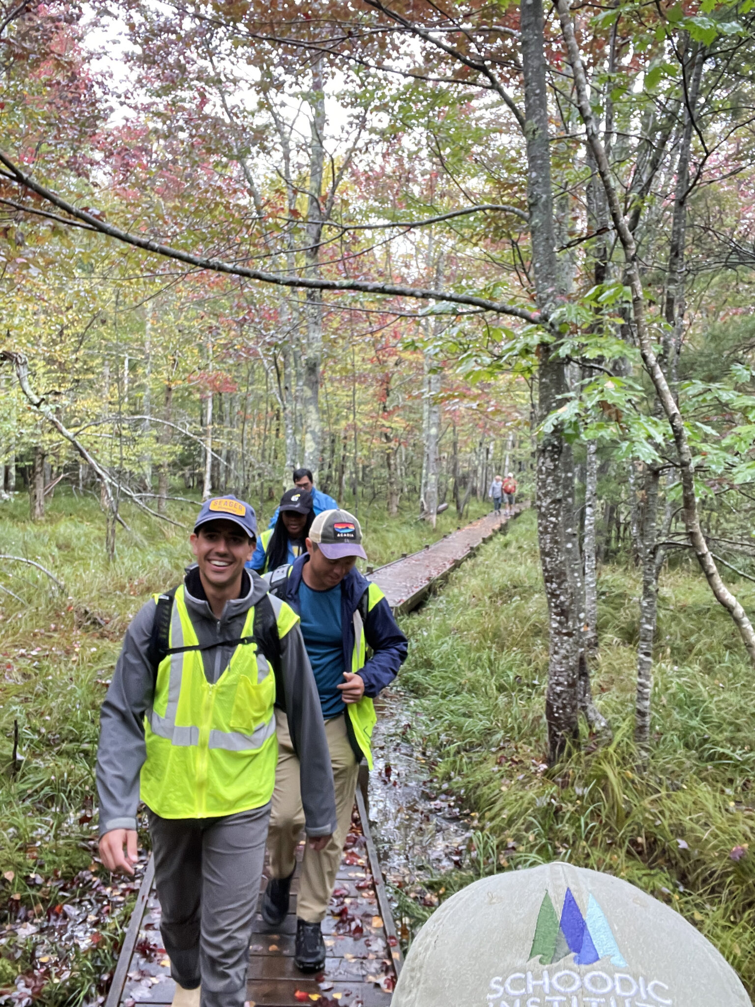 Earthwatch volunteers walk along the Jessup Trail to collect biodiversity data.