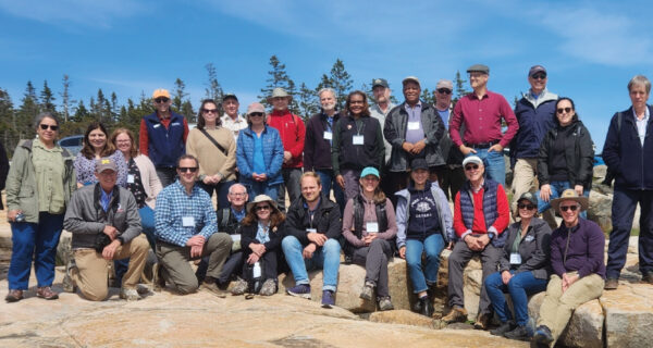 A group of conservation professionals gather at Schoodic Point in Acadia National Park.