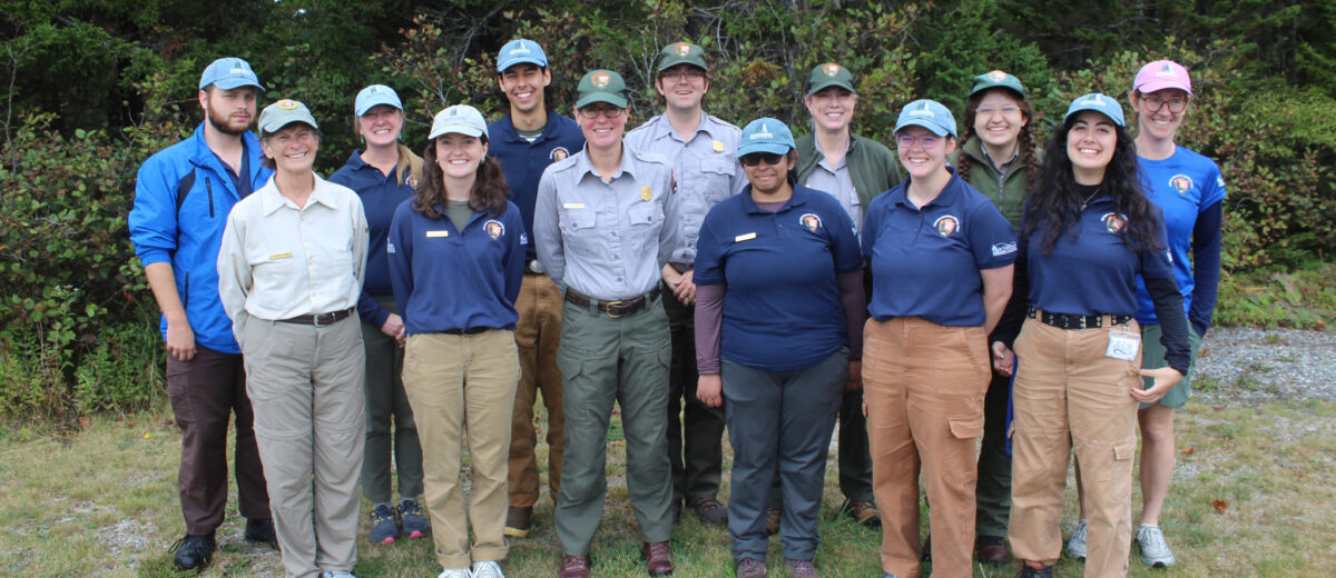 A group of Schoodic Education Adventure (SEA) program staff gather for a group photo