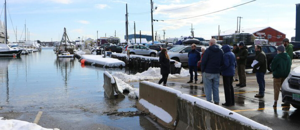 Folks gather by the docks in Portland, Maine for a community meetup on a winter day