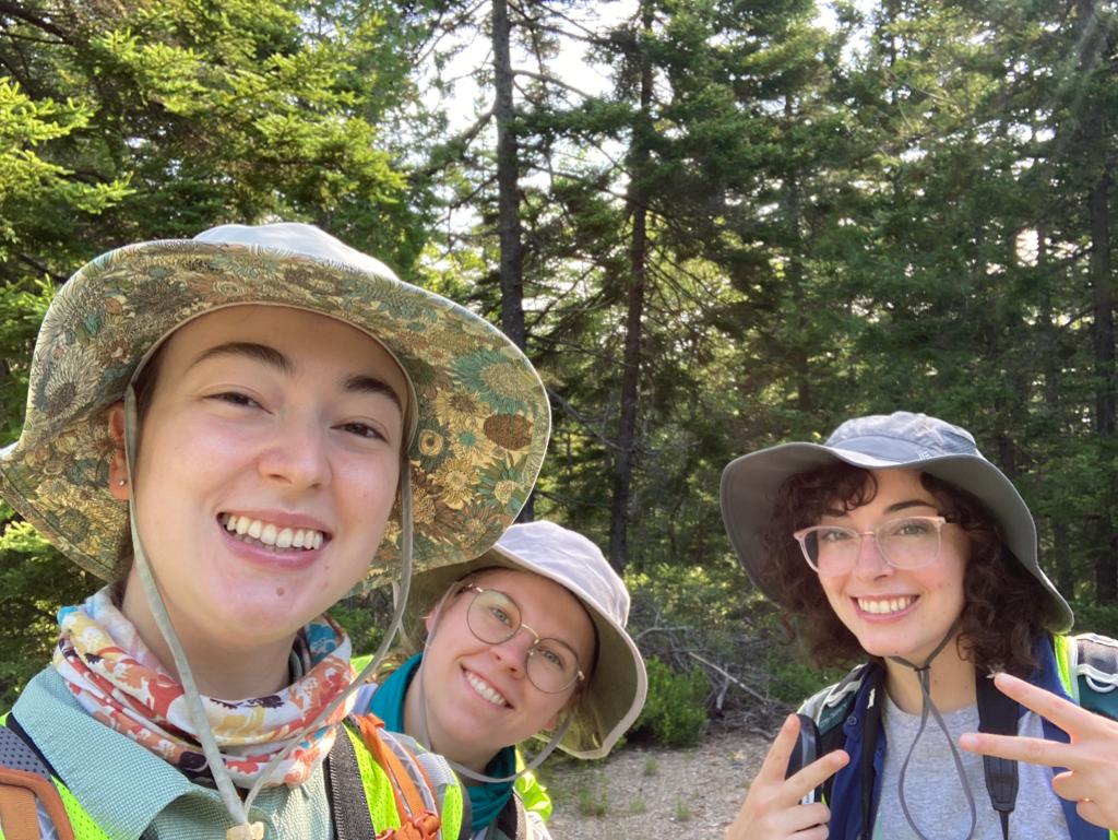 From right to left: Brooke Goodman, Ev Dyer, and Ella Halbert celebrate after a successful day of fieldwork